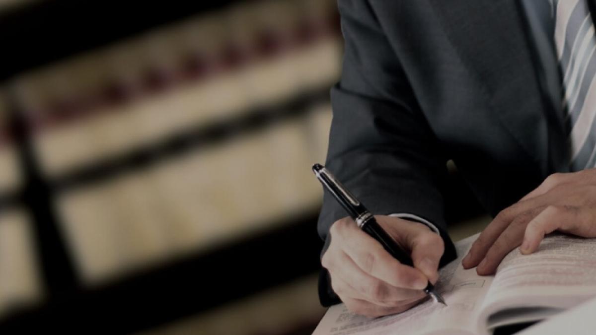 Man writing a document